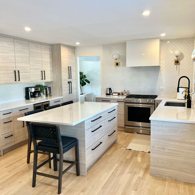 Modern kitchen with stainless steel gas range and island in Chicago & Suburbs, IL